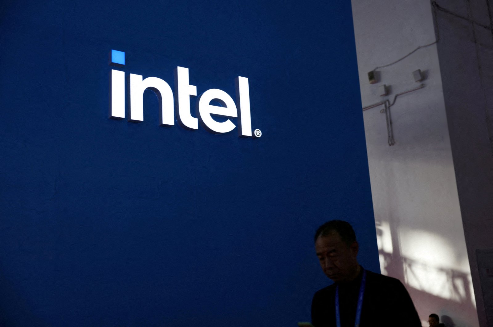 A man walks past the Intel logo at its booth during the first China International Supply Chain Expo (CISCE), Beijing, China, Nov. 28, 2023. (Reuters Photo)