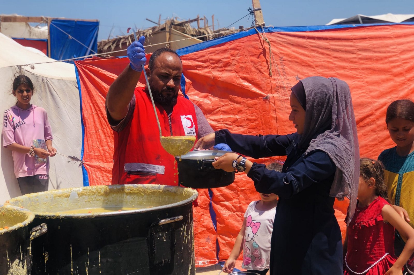 Turkish Red Crescent team provides meals to people in the Deyr Belah area of Gaza, Palestine, June 11, 2024. (AA Photo)