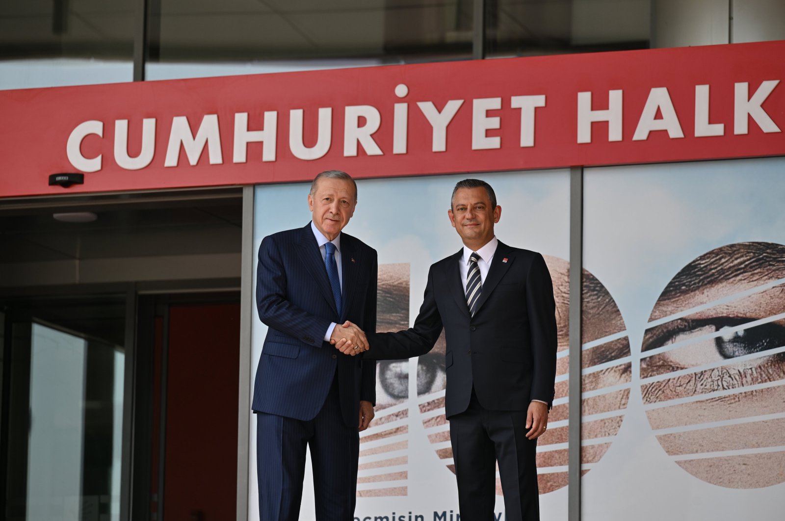 President Recep Tayyip Erdoğan (L) shakes hands with Özgür Özel outside the CHP offices, Ankara, Türkiye, June 11, 2024. (AA Photo)