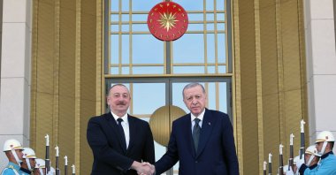 President Recep Tayyip Erdoğan (R) shakes hands with Azerbaijani President Ilham Aliyev outside the Presidential Complex, Ankara, Türkiye, June 10, 2024. (AA Photo)