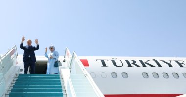 President Recep Tayyip Erdoğan (L) and first lady Emine Erdoğan wave as they embark on the presidential plane, Ankara, Türkiye, June 12, 2024. (DHA Photo)