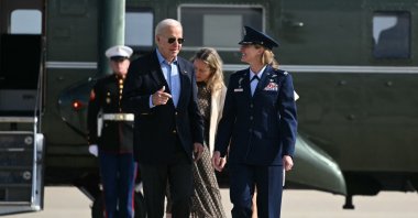 U.S. President Joe Biden is welcomed by Air Force Colonel Angela Ochoa as he arrives to board Air Force One at Joint Base Andrews in Maryland, June 12, 2024. (AFP Photo)