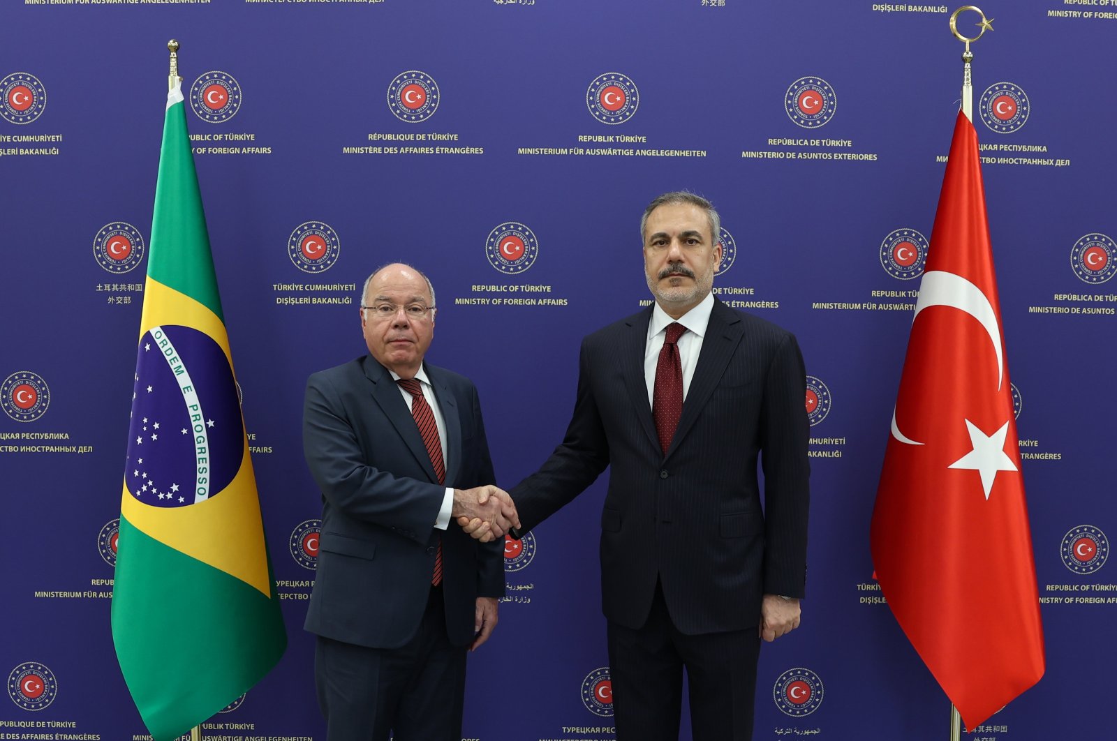 Foreign Minister Hakan Fidan and Brazilian counterpart Mauro Vieira shake hands after a meeting in Ankara, June 12, 2024. (AA Photo)