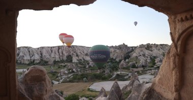 In Cappadocia, hot air balloons created a beautiful sight in the green-toned valleys, Cappadocia, Türkiye, June 4, 2024. (AA Photo) 