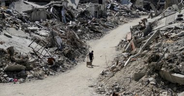 A Palestinian walks among the rubble of buildings destroyed by Israel&#039;s military offensive, in Beit Lahia, northern Gaza Strip, Palestine, June 12, 2024. (Reuters Photo)