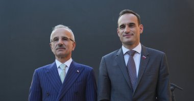 Transport and Infrastructure Minister Abdulkadir Uraloğlu (L) and Slovenia's Ambassador to Ankara, Gorazd Rencelj, pose for a photo during an event in Ankara, Türkiye, June 6, 2024. (AA Photo)