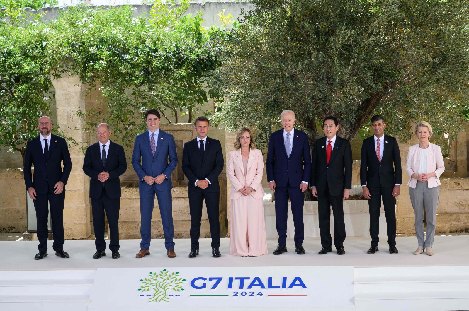 From left, European Council President Charles Michel, German Chancellor Olaf Scholz, Canadian Prime Minister Justin Trudeau, French President Emmanuel Macron, Italy&#039;s Prime Minister Giorgia Meloni, U.S. President Joe Biden, Japanese Prime Minister Fumio Kishida, British Prime Minister Rishi Sunak and President of the European Commission Ursula von der Leyen pose for a family photo during the G-7 Summit in Apulia region, Italy, June 13, 2024. (AFP Photo)