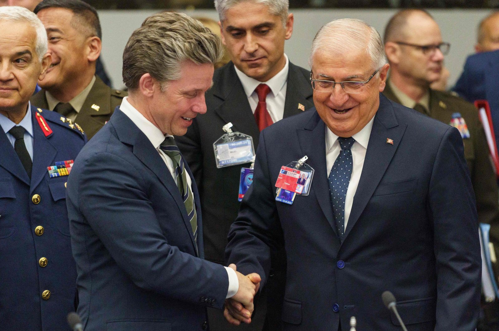 Yaşar Güler and Sweden&#039;s Minister of Defense Pal Jonson shake hands before a meeting of the Ukraine Defense Contact Group, during the NATO Ministers of Defence at NATO Headquarters in Brussels on June 13, 2024. (AFP Photo)