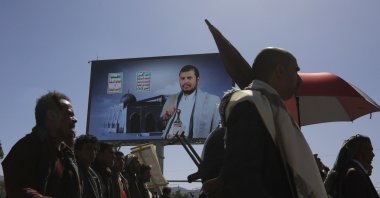Houthi supporters pass a billboard featuring Houthis&#039; leader Abdul-Malik al-Houthi, during a protest against the U.S. and Israel, and in solidarity with the Palestinian people, Sanaa, Yemen, June 7, 2024. (EPA Photo)