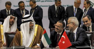 United Arab Emirates&#039; Energy Minister Suhail Mohamed al-Mazrouei (L) and Türkiye&#039;s Transport Minister Abdulkadir Uraloğlu speak during the signing of the &quot;Development Road&quot; framework agreement in Baghdad, Iraq, April 22, 2024. (AP Photo)