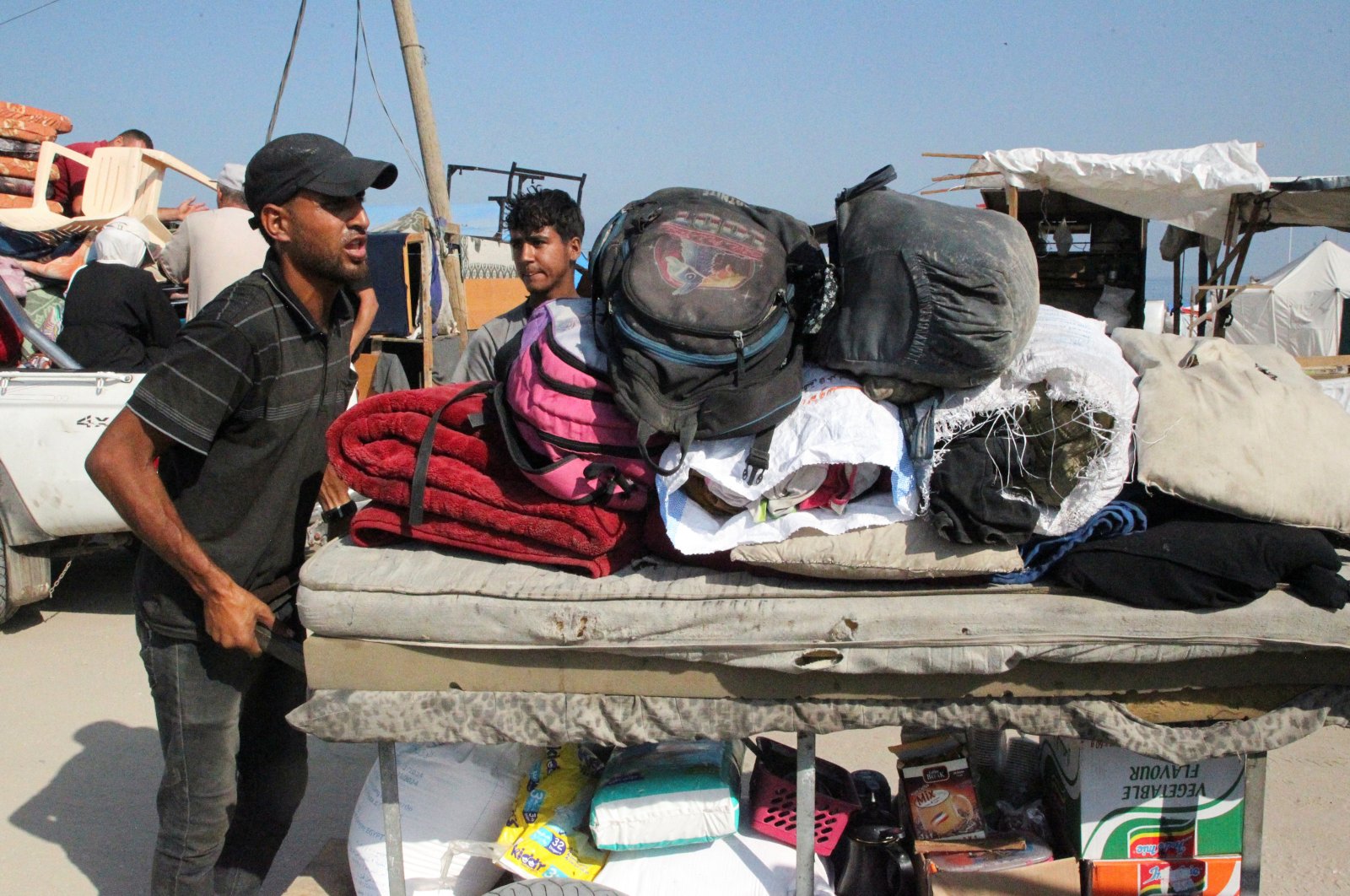 Palestinians travel on foot with their belongings as they flee Rafah due to an Israeli military operation, Gaza Strip, Palestine, June 13, 2024. (Reuters Photo)