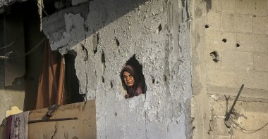 A Palestinian woman looks out from her destroyed house on the first day of Eid al-Adha in Khan Younis, southern Gaza Strip, Palestine, June 16, 2024. (EPA Photo)