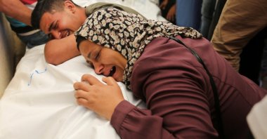 Mourners react next to the bodies of Palestinians, killed in Israeli strikes in Rafah, during their funeral in Khan Younis, southern Gaza Strip, Palestine, June 18, 2024. (Reuters Photo)