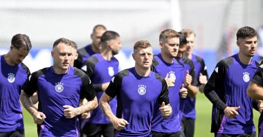 Germany players warm up during a training session, Herzogenaurach, Germany, June 18, 2024. (AP Photo)