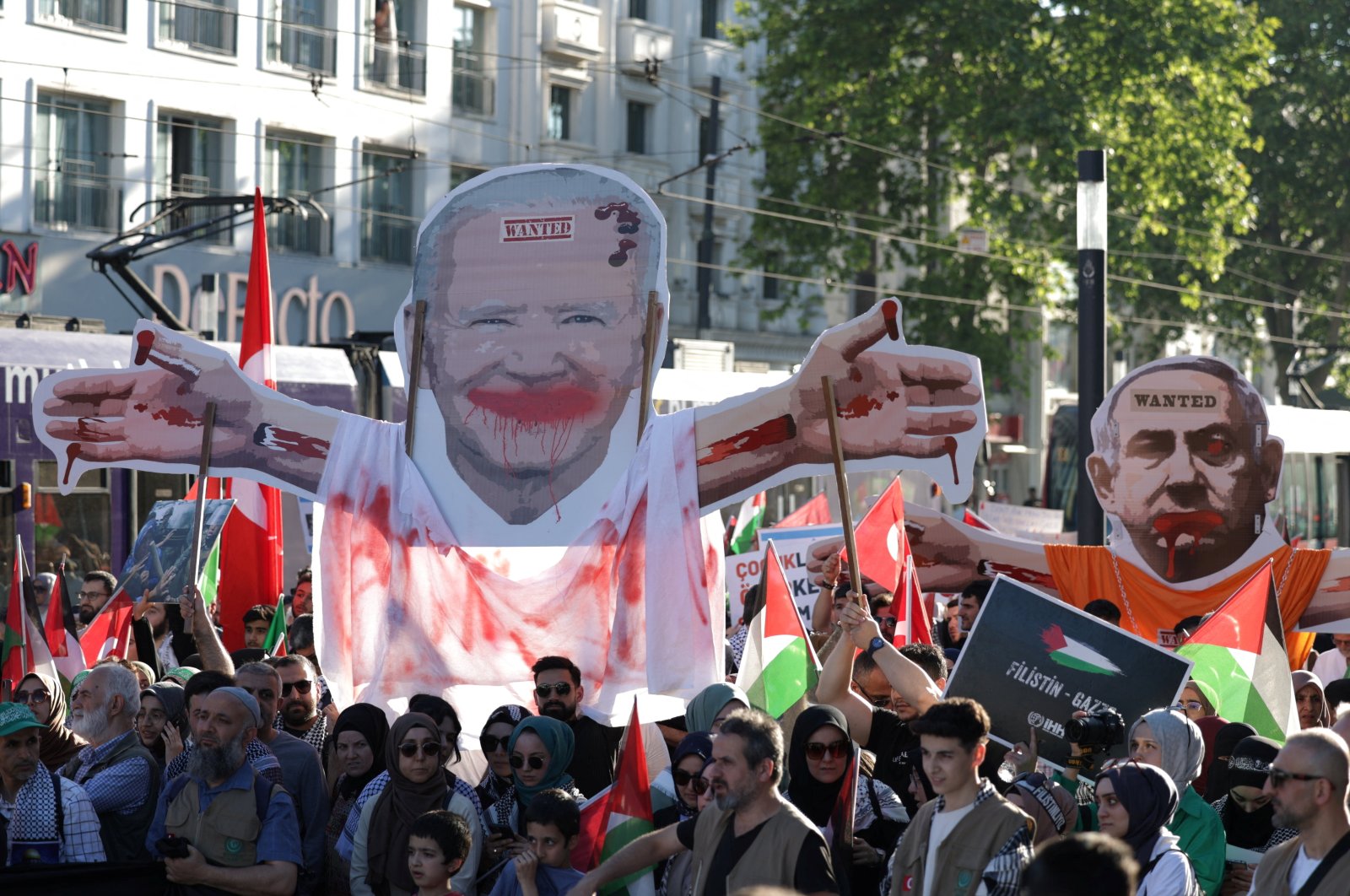 Demonstrators carry placards depicting U.S. President Joe Biden and Israeli Prime Minister Benjamin Netanyahu during a pro-Palestinian rally, Istanbul, Türkiye, June 1, 2024. (Reuters Photo)