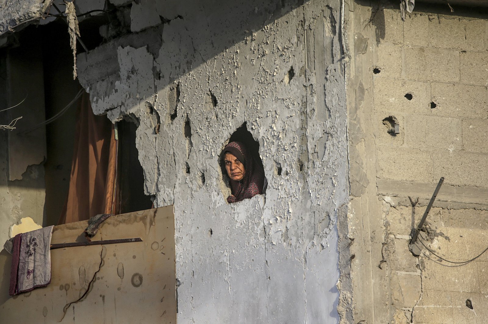 A Palestinian woman looks out from her destroyed house on the first day of Eid al-Adha in Khan Younis, southern Gaza Strip, Palestine, June 16, 2024. (EPA Photo)