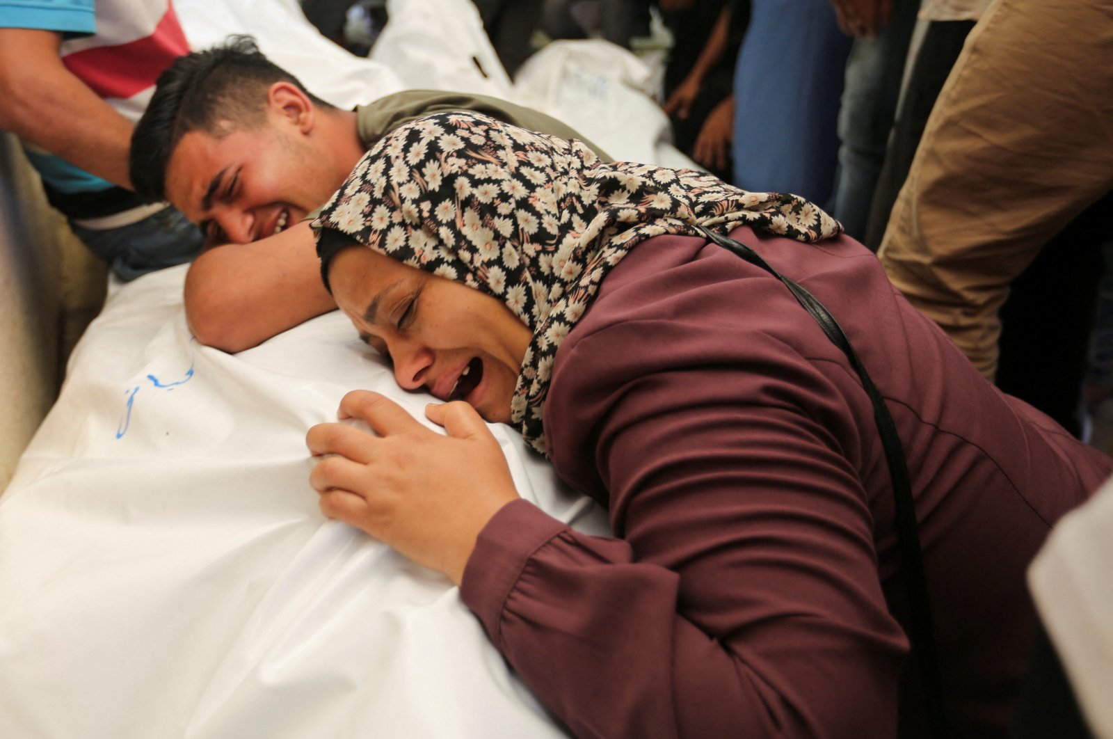 Mourners react next to the bodies of Palestinians, killed in Israeli strikes in Rafah, during their funeral in Khan Younis, southern Gaza Strip, Palestine, June 18, 2024. (Reuters Photo)