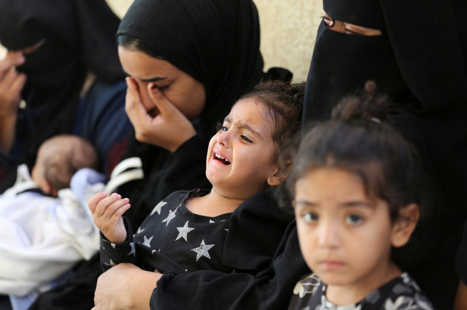 Mourners react next to the bodies of Palestinians killed in Israeli strikes in Rafah, southern Gaza Strip, Palestine, June 18, 2024. (Reuters Photo)