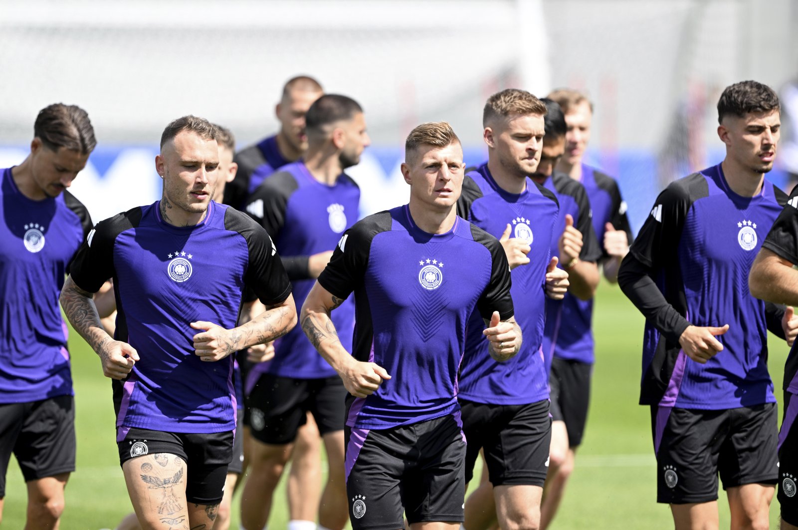 Germany players warm up during a training session, Herzogenaurach, Germany, June 18, 2024. (AP Photo)