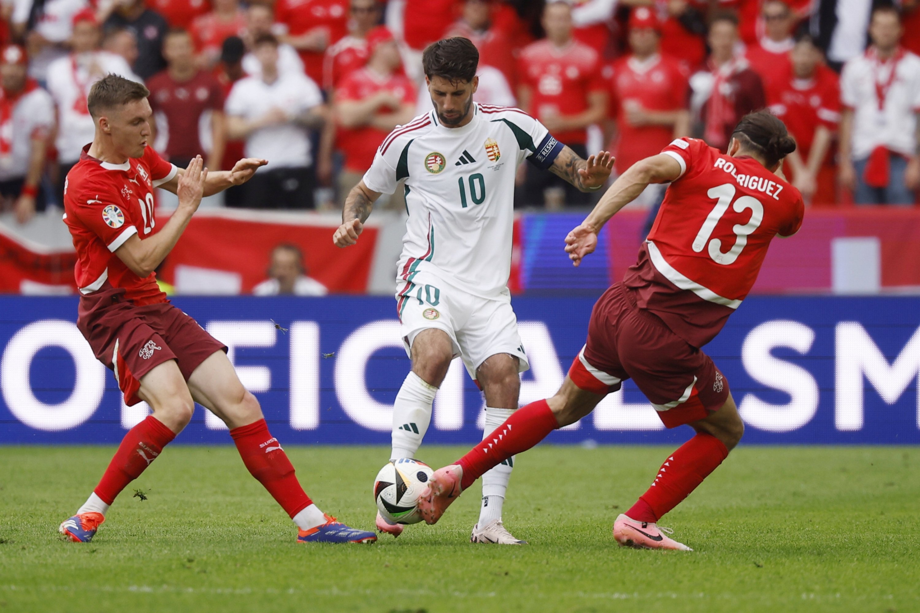 Dominik Szoboszlai (C) of Hungary in action against Ricardo Rodriguez (R) and Michel Aebischer of Switzerland during the UEFA EURO 2024 group A match between Hungary and Switzerland, Cologne, Germany, June 15, 2024. (EPA Photo)