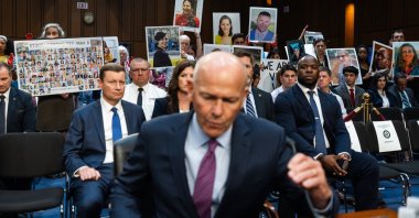 Relatives who lost loved ones in the crash of a Boeing aircraft stand behind outgoing Boeing CEO David Calhoun as he prepares to testify before a U.S. Senate committee amid an ongoing safety investigation into the airline manufacturer, Washington, D.C., U.S., June 18, 2024. (EPA Photo)