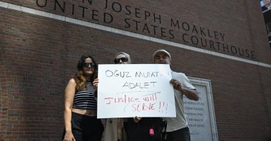 Members of the Turkish diaspora hold a placard demanding justice for the death of Oğuz Murat Aci in a hit-and-run involving Timur Cihantimur as Cihantimur&#039;s hearing proceeds at a courthouse, Boston, Massachusetts, U.S., June 18, 2024. (AA Photo)