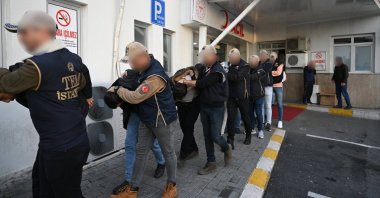 Suspects detained as part of an investigation into Mossad's activities in Türkiye are escorted by police to undergo routine medical checks, Istanbul, Türkiye, Jan. 4, 2024. (AA Photo)