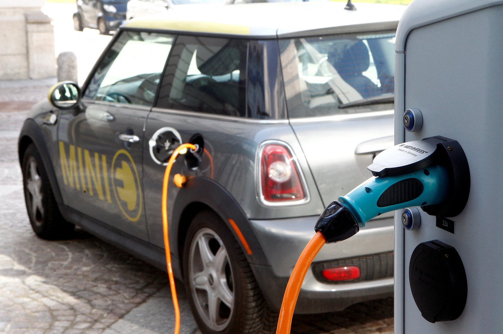 A BMW Mini electric car is charged at a station, downtown Munich, Germany, March 29, 2012. (Reuters Photo)