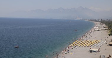 People flocked to the beaches to escape the intense heat during Qurban Bayram, Antalya, Türkiye, June 20, 2024. (IHA Photo)