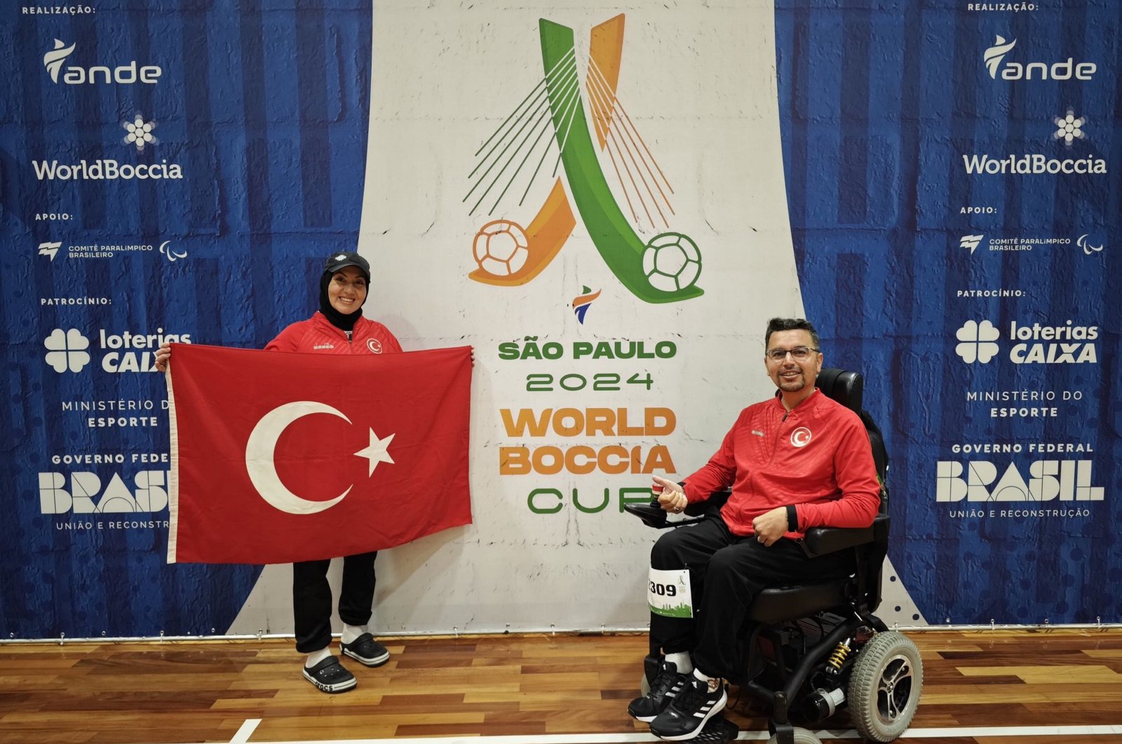 Turkish para-athlete Öner Bozbıyık (R) with his trainer and wife Sema Bozbıyık after winning at the Boccia World Cup, Sao Paulo, Brazil, June 4, 2024. (AA Photo)