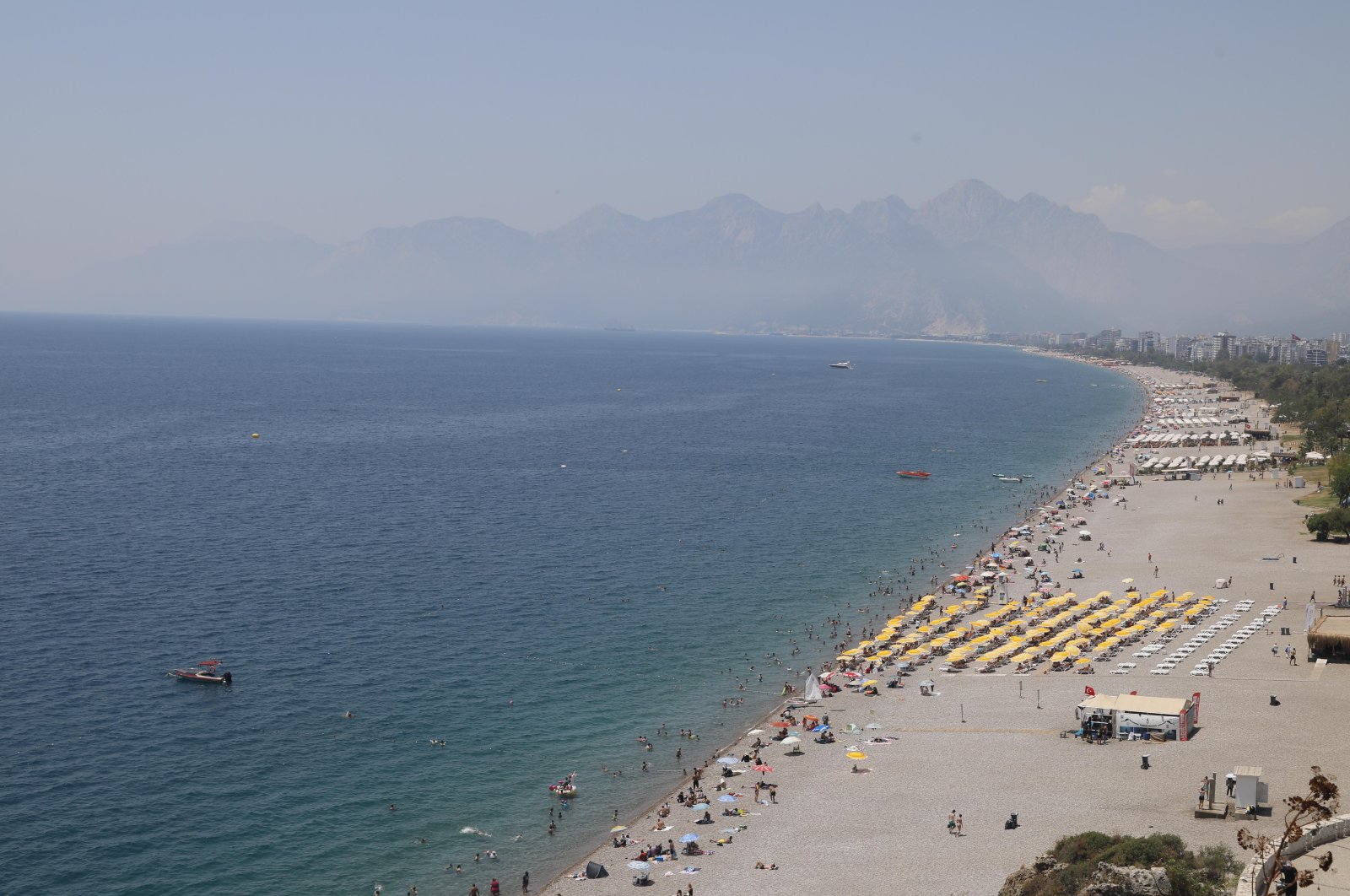 People flocked to the beaches to escape the intense heat during Qurban Bayram, Antalya, Türkiye, June 20, 2024. (IHA Photo)