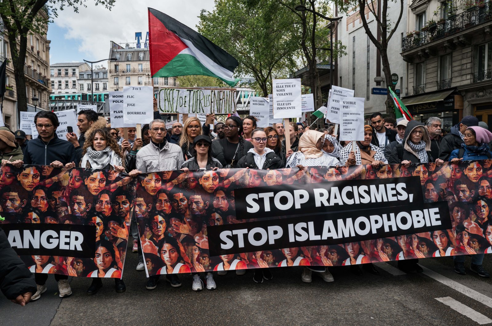 Demonstrators are holding a banner that reads &quot;Stop Racism, Stop Islamophobia&quot; during a protest against racism and Islamophobia in Paris, France, on April 21, 2024. (Reuters File Photo)