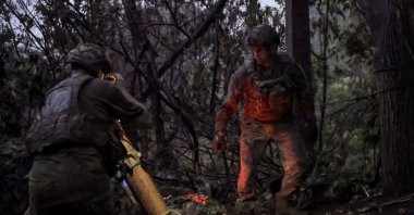 Ukrainian servicemen of the 24th Mechanized Brigade named after King Danylo operating a 120 mm mortar at an undisclosed location near the front line city of Chasiv Yar, Donetsk, Ukraine, June 20, 2024. (Ukrainian army handout via EPA Photo)