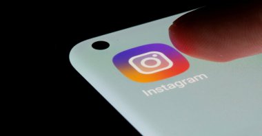 An Instagram app icon is seen on a smartphone in this illustration taken on July 13, 2021. (Reuters Photo)