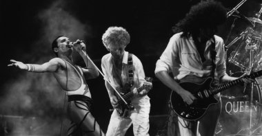 British rock group Queen in concert, from left to right, Freddie Mercury, John Deacon and Brian May. (Getty Images Photo)