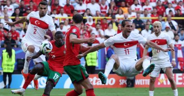 Turkish and Portugal players react during a Euro 2024 match in Dortmund, Germany, June 22, 2024. (EPA Photo)