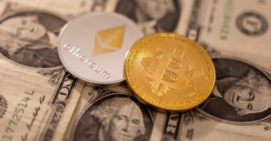 A representation of cryptocurrencies Bitcoin and Ethereum placed on U.S. dollars in this illustration, Jan. 24, 2022. (Reuters Photo)