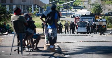 French gendarmes face pro-independence protesters as clashes occur in Dumbea, on the French Pacific territory of New Caledonia, June 24, 2024. (AFP Photo)