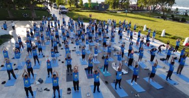 A drone view shows participants practicing yoga during the 10th International Day of Yoga, Istanbul, Türkiye, June 21, 2024. (Reuters Photo)