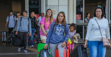 Passengers exit the airport as they arrive in the Mediterranean tourism hot spot Antalya, southern Türkiye, Sept. 22, 2022. (DHA Photo)