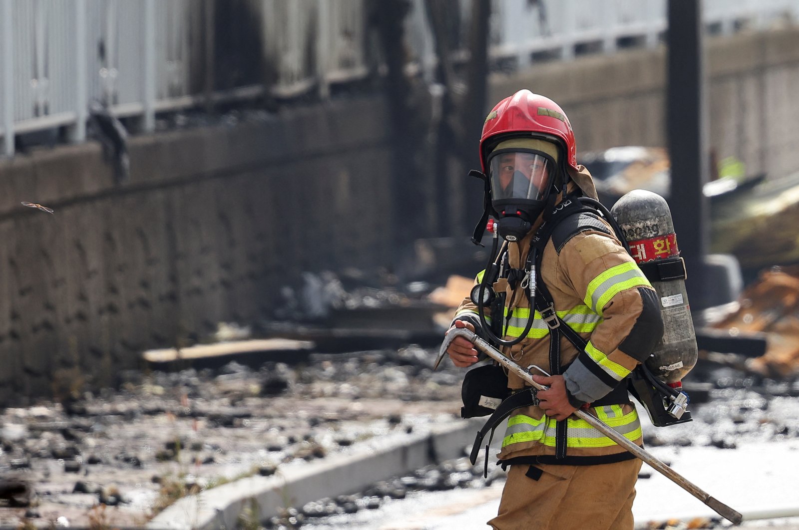 A firefighter works at the site of a deadly fire at a lithium battery factory in Hwaseong, South Korea, June 24, 2024. (Reuters Photo)