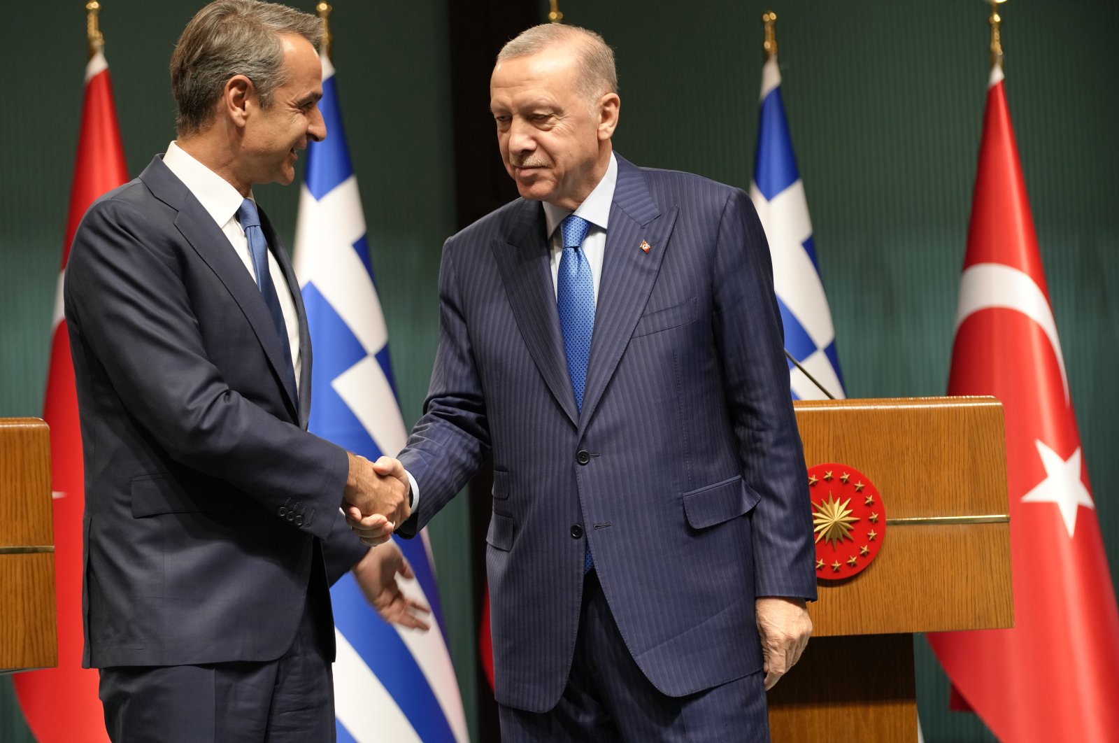 Greek Prime Minister Kyriakos Mitsotakis (L) and President Recep Tayyip Erdoğan shake hands after a joint news conference in the capital Ankara, Türkiye, May 13, 2024. (AP Photo) 