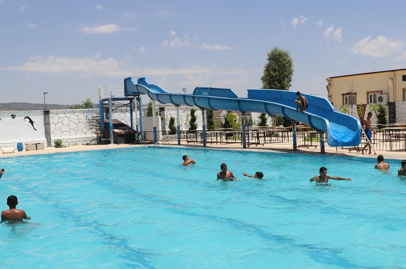 Children play in a pool to escape the hot weather, Kilis, Türkiye, June 23, 2024. (AA Photo)