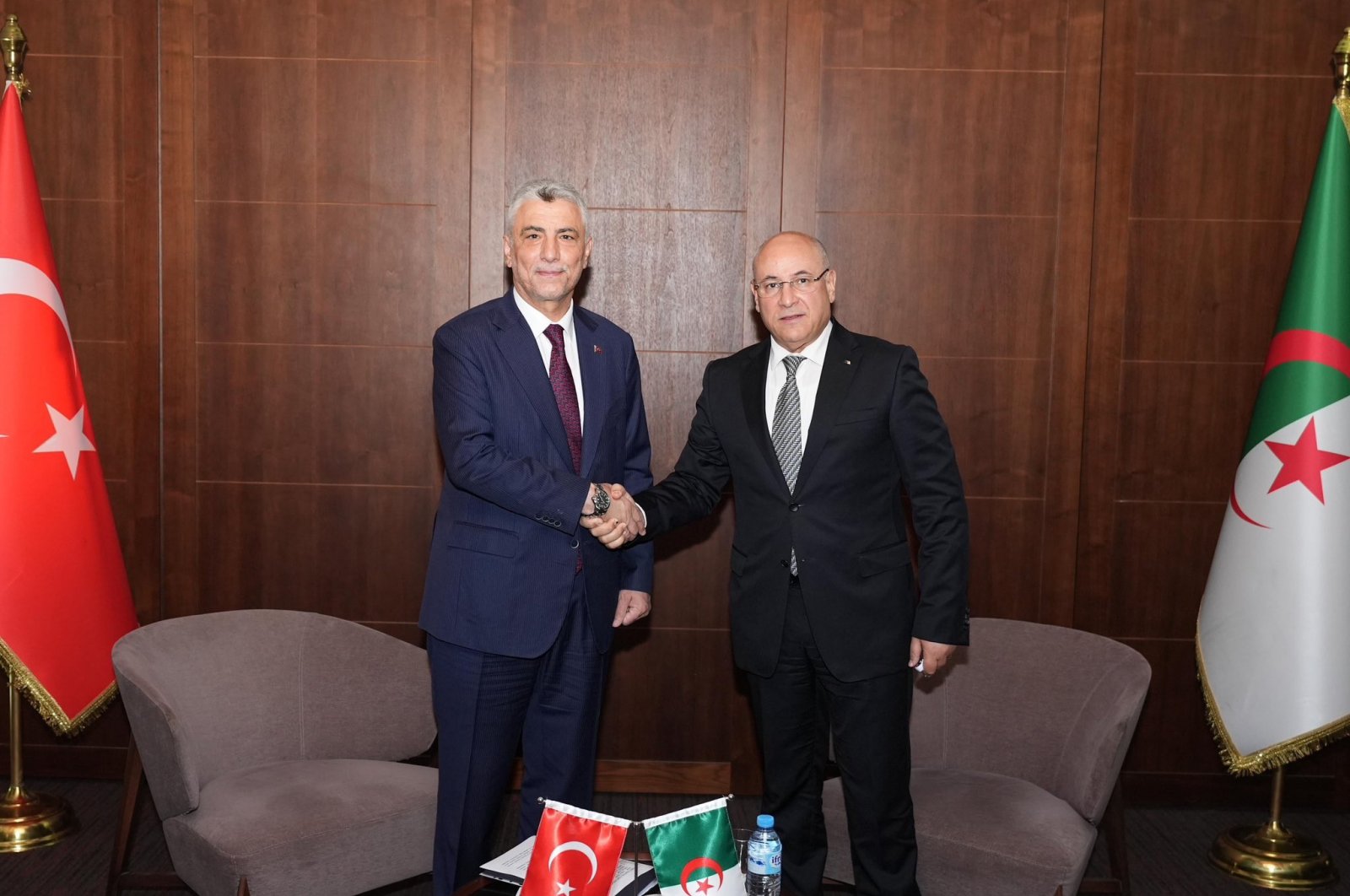 Trade Minister Ömer Bolat (L) shakes hands with Algerian Trade and Export Promotion Minister Tayeb Zitouni, Algiers, Algeria, June 24, 2024. (IHA Photo)