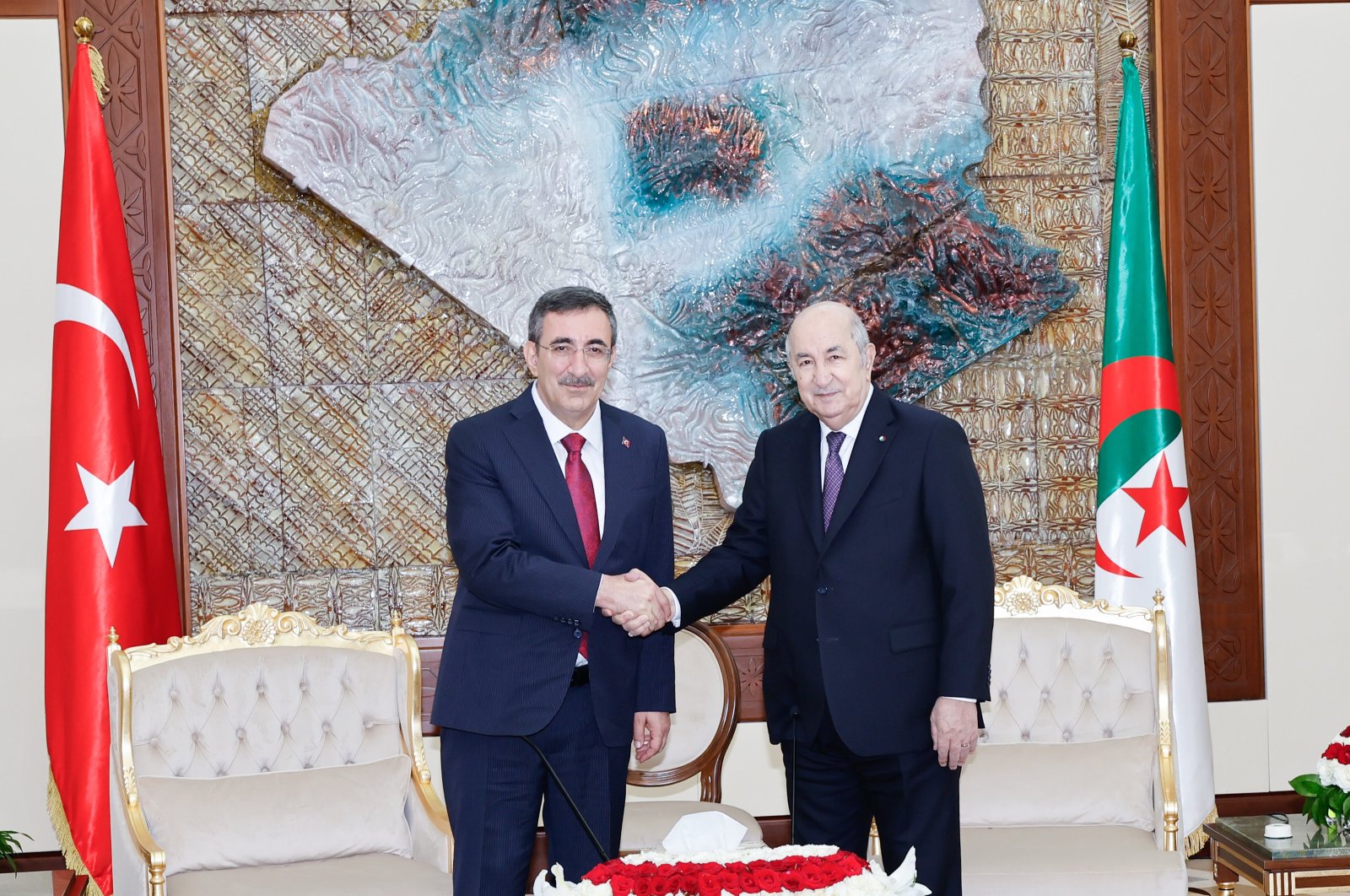 Vice President Cevdet Yılmaz and Algerian President Abdelmadjid Tebboune shake hands at Mouradia Palace in the capital Algiers, Monday June 24, 2024. (AA Photo)