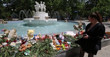A woman visits a makeshift memorial to people killed in a Ukrainian airstrike, in Sevastopol, Crimea, June 24, 2024. (Reuters Photo)