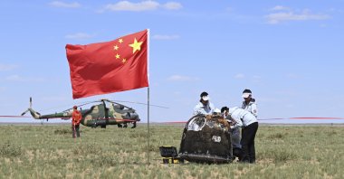 Workers access the returned capsule of the Chang&#039;e 6 probe in Siziwang Banner, northern China&#039;s Inner Mongolia Autonomous Region, June 25, 2024. (AP Photo)