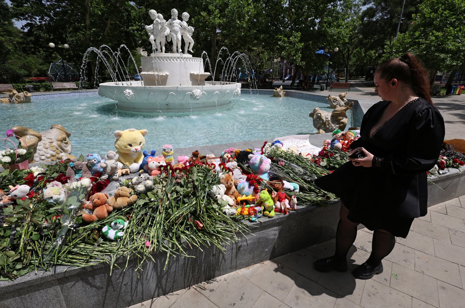 A woman visits a makeshift memorial to people killed in a Ukrainian airstrike, in Sevastopol, Crimea, June 24, 2024. (Reuters Photo)