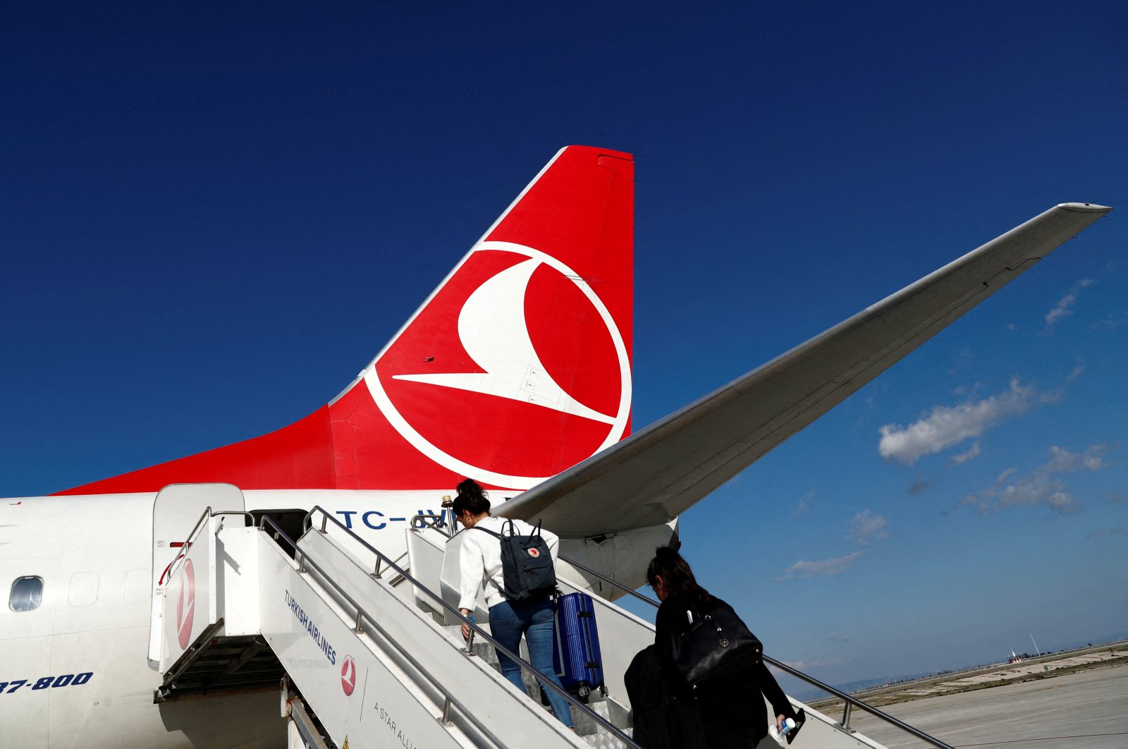 Passengers board a Turkish Airlines (THY) Boeing 777-800 plane at Hatay Airport, Hatay, southern Türkiye, March 1, 2020. (Reuters Photo)