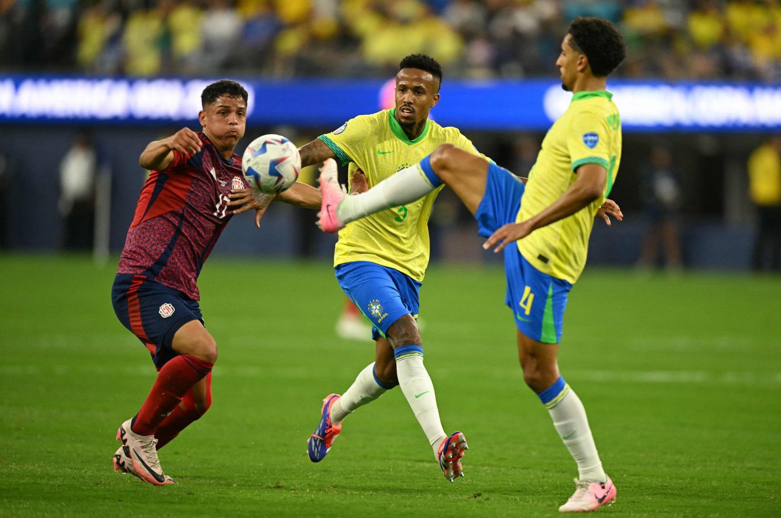 Costa Rica&#039;s Warren Madrigal (L) fights for the ball with Brazil&#039;s Marquinhos (R) and Eder Militao during the Conmebol 2024 Copa America tournament Group D football match between Brazil and Costa Rica at SoFi Stadium, Inglewood, California, U.S., June 24, 2024. (AFP Photo)